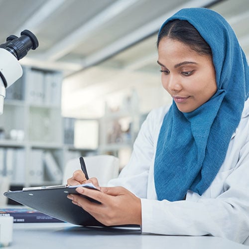 Female lab technician filling out ExpressReqs™ form